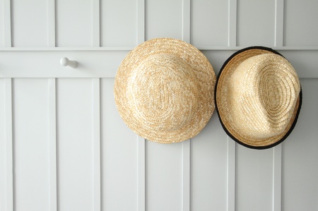 two weaving hats on white wallの写真素材