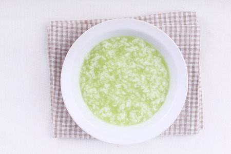 Rice pudding  in an individual bowl on white backgroundの写真素材