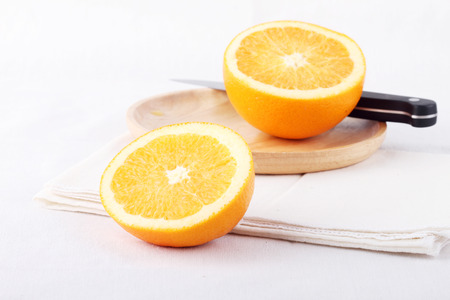 sliced fresh orange on white fabricの写真素材