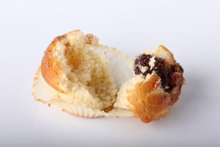 splited cupcake on white backgroundの写真素材