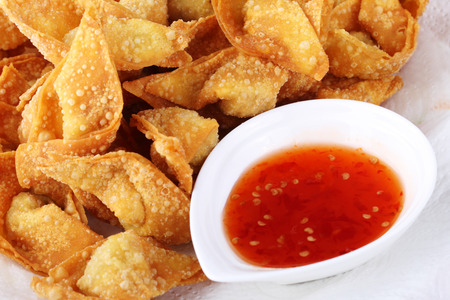 Fried dumpling and sauce on white paperの写真素材