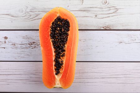 chop of papaya on wood tableの写真素材