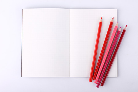 Colour pencils with blank notebook isolated on white background,theme colorの写真素材