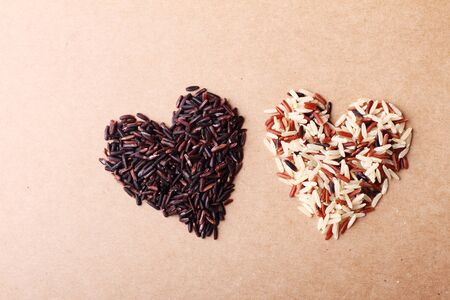 long grain rice,brown rice, keep healthy concept, brown backgroundの写真素材
