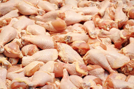 Raw chicken legs on marketの写真素材