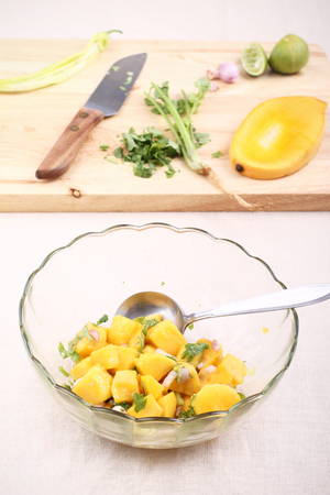 Fresh salad with mango, red shallot, green pepper and pasleyの写真素材