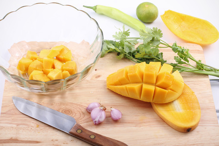 Fresh salad with mango, red shallot, green pepper and pasley,making processの写真素材