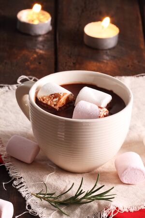 hot chocolate in cup with candlesの写真素材