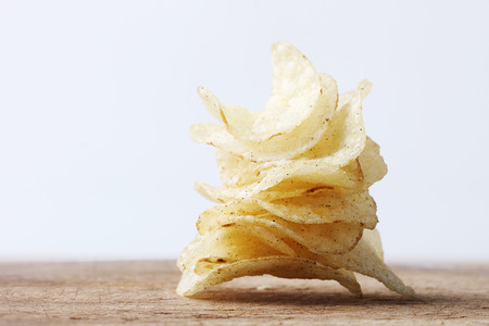 stack of tasty traditional potato chips snacksの写真素材