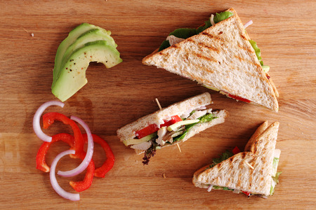 Sandwich of whole wheat bread with chicken and avocadoの写真素材