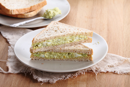 healthy avocado egg salad fill in  whole wheat sandwich bread for breakfastの写真素材