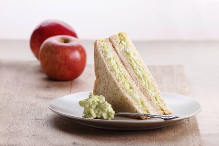 healthy avocado egg salad fill in  whole wheat sandwich bread for breakfastの写真素材
