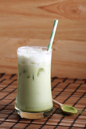 glass of iced green tae latteの写真素材