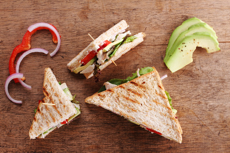 Sandwich of whole wheat bread with chicken and avocadoの写真素材
