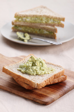 healthy avocado egg salad fill in  whole wheat sandwich bread for breakfastの写真素材
