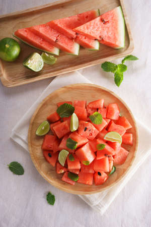 Healthy fresh watermelon salad with mint and lime, top viewの写真素材