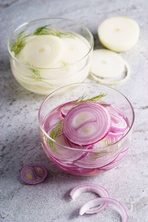 bowl of pickled red and white onionsの写真素材