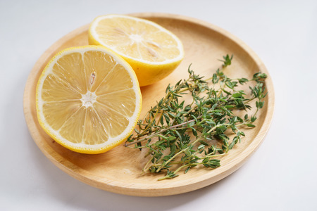 match ingredients, lemon and thyme on white backgroundの写真素材