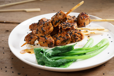 sesame beef skewers with green vegetableの写真素材