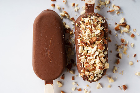 vanilla ice cream coat with chocolate and top with almond.