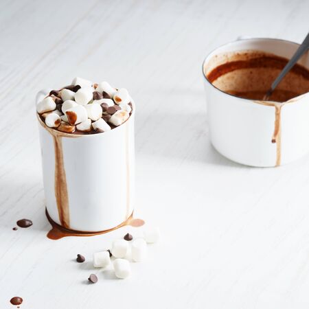 hot chocolate in white cup with marshmallows and chocolate chipの写真素材