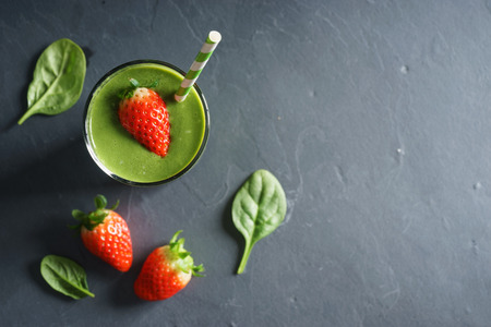 healthy green smoothie with spinach and fresh strawberryの写真素材