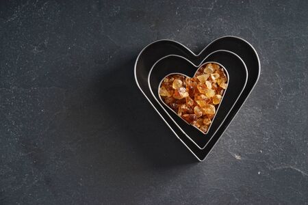 heart shape cutters with brown sugar, love conceptの写真素材