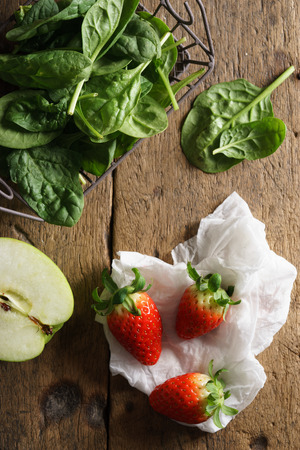 fresh green apple, spinach, and strawberries for healthy smoothie ingredientsの写真素材