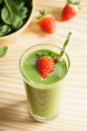 healthy green smoothie with spinach and fresh strawberryの写真素材