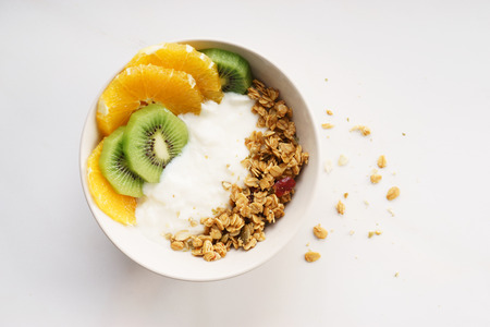 Healthy breakfast.  Oat granola with yogurt and fresh sliced fruitsの写真素材