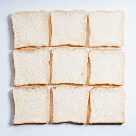 sliced white bread arrange as square table, top view