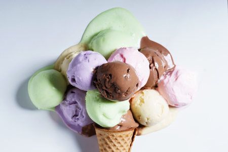 various color ice cream scoops on waffle cone, top viewの写真素材