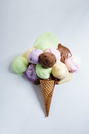various color ice cream scoops on waffle cone, top viewの写真素材