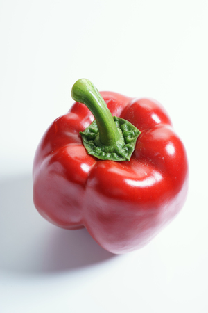 fresh red bell pepper on a white backgroundの写真素材