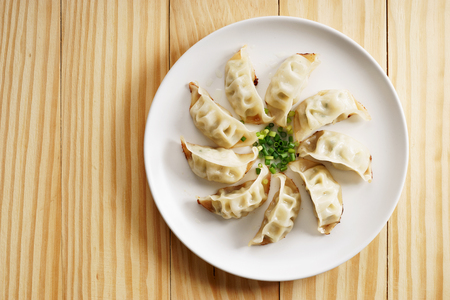 plate of Japanese gyoza, dumplings snack , with soy sauceの写真素材