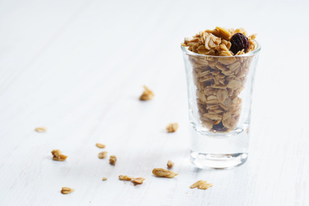 Homemade granola with dried fruit and nuts in a glass, healthy food 