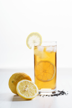 glass of iced tea with fresh lemonの写真素材