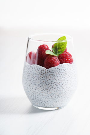 chia seed pudding almond milk with fresh raspberries, healthy eating.の写真素材