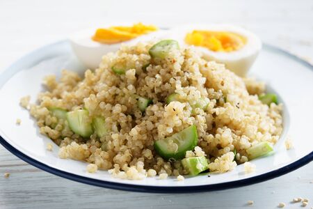 quinoa salad with cucumber and boiled egg, healthy breakfast.の写真素材