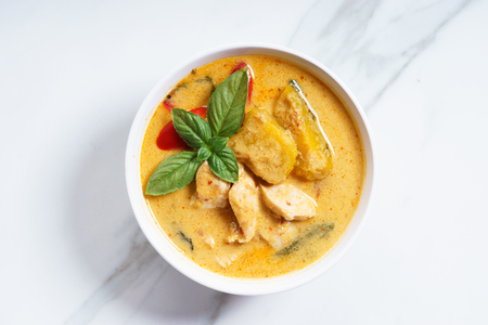Pumpkin and coconut cream curry with chicken meat, asian recipeの写真素材