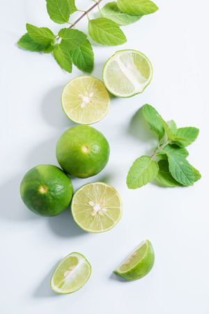 fresh limes and slices with mint leavesの写真素材