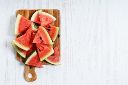 Watermelon Cut into Wedges on wooden backgroundの写真素材