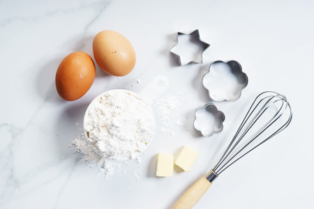 flour in white cup with egg, cooking conceptの写真素材