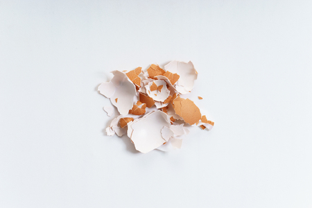 broken eggshells on white backgroundの写真素材