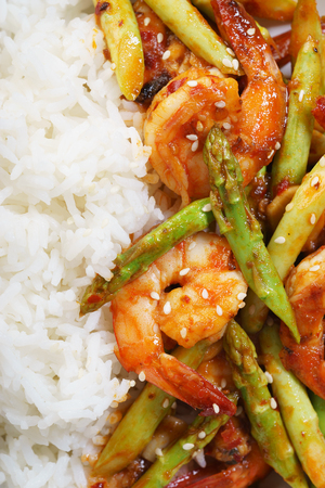 Prawn meat with spicy sauce and asparagus served with riceの写真素材