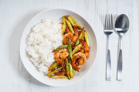 Prawn meat with spicy sauce and asparagus served with riceの写真素材