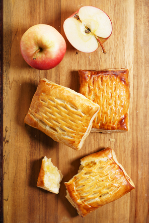 apple sweet pies on wooden backgroundの写真素材