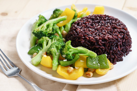 brown rice with broccoli and bell pepper sauce fried, vegetarian food.の写真素材
