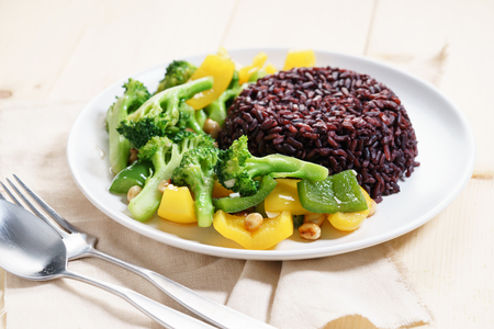 brown rice with broccoli and bell pepper sauce fried, vegetarian food.の写真素材