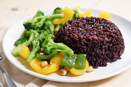 brown rice with broccoli and bell pepper sauce fried, vegetarian food.の写真素材